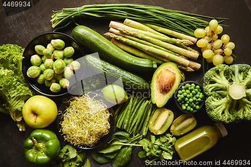 Image of Green healthy food composition with avocado, broccoli, apple, smoothie...