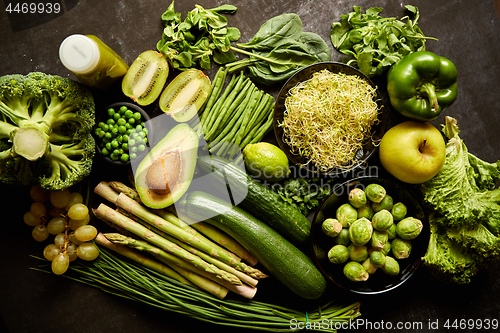 Image of Green healthy food composition with avocado, broccoli, apple, smoothie...