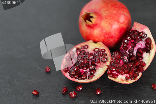 Image of close up of pomegranate on stone table