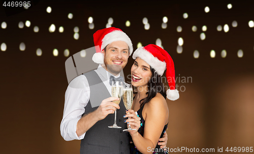 Image of couple with champagne glasses at christmas party