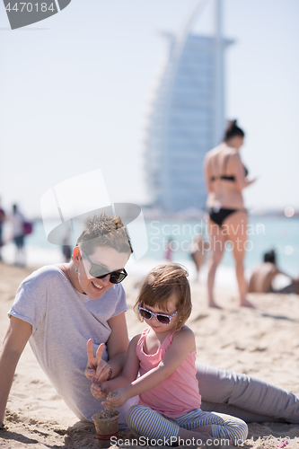 Image of Mom and daughter on the beach