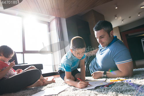 Image of young couple spending time with kids