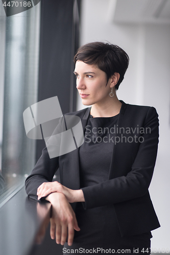 Image of Portrait of successful Businesswoman by the window