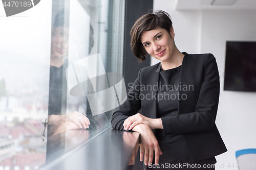 Image of Portrait of successful Businesswoman by the window