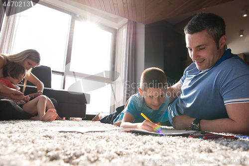 Image of young couple spending time with kids