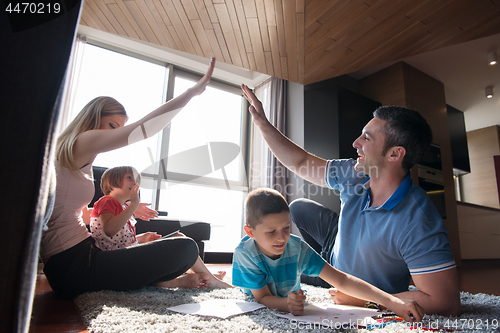 Image of young couple spending time with kids