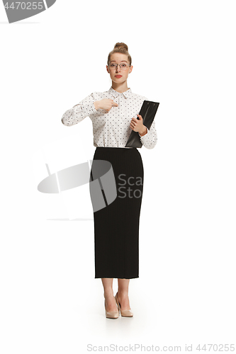 Image of Full length portrait of a female teacher holding a folder isolated against white background