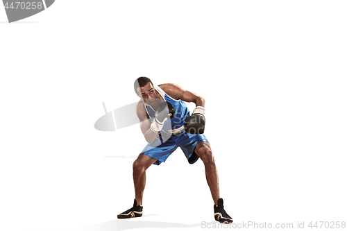 Image of Sporty man during boxing exercise making hit. Photo of boxer on white background
