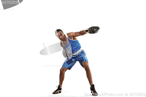 Image of Sporty man during boxing exercise making hit. Photo of boxer on white background