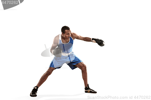 Image of Sporty man during boxing exercise making hit. Photo of boxer on white background