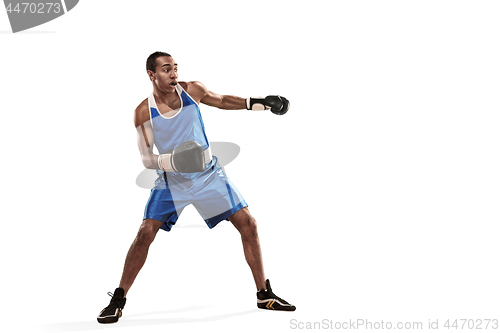 Image of Sporty man during boxing exercise making hit. Photo of boxer on white background