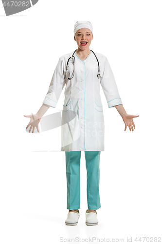 Image of Beautiful young woman in white coat posing at studio. Full length studio shot isolated on white.
