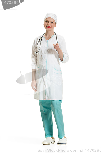 Image of Beautiful young woman in white coat posing at studio. Full length studio shot isolated on white.