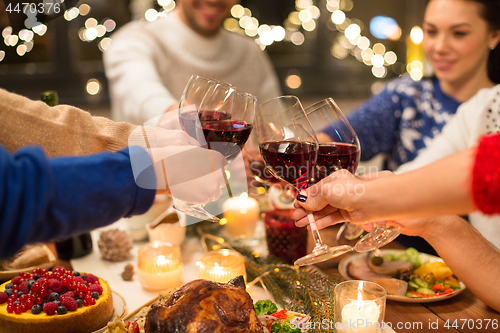 Image of close up of friends with wine celebrate christmas