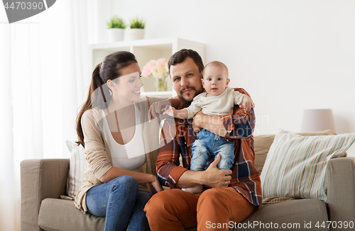 Image of happy family with baby at home