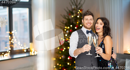 Image of happy couple with champagne glasses at party