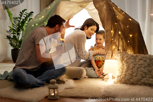 Image of father telling scary stories to his daughter