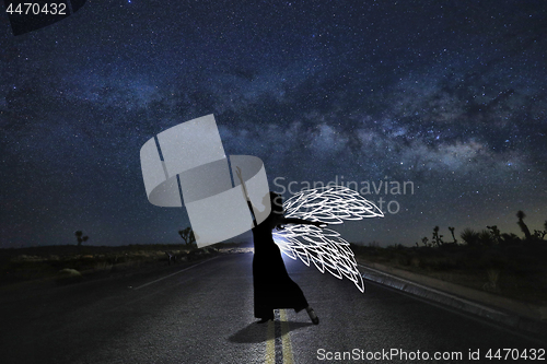 Image of Girl Light Painted in the Desert Under the Night Sky