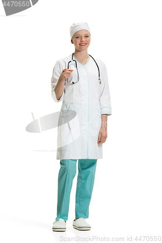 Image of Beautiful young woman in white coat posing at studio. Full length studio shot isolated on white.