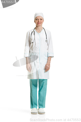 Image of Beautiful young woman in white coat posing at studio. Full length studio shot isolated on white.