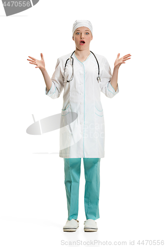 Image of Beautiful young woman in white coat posing at studio. Full length studio shot isolated on white.
