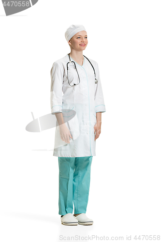 Image of Beautiful young woman in white coat posing at studio. Full length studio shot isolated on white.