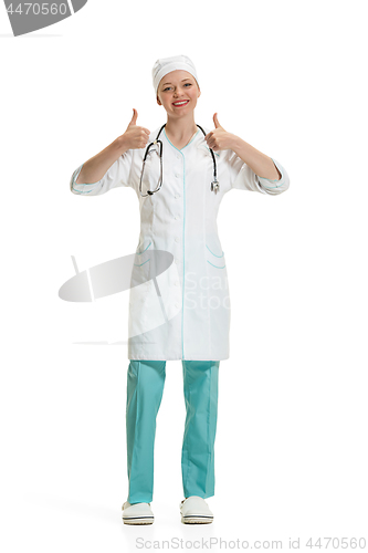Image of Beautiful young woman in white coat posing at studio. Full length studio shot isolated on white.