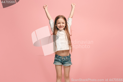 Image of Happy success teen girl celebrating being a winner. Dynamic energetic image of female model