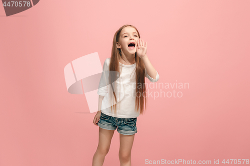 Image of Isolated on pink young casual teen girl shouting at studio