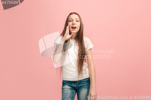 Image of young casual teen girl shouting at studio