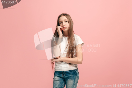 Image of Young serious thoughtful teen girl. Doubt concept.