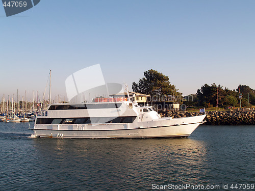 Image of Large motor yacht heading out of marina