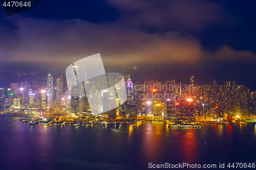 Image of Aerial view of illuminated Hong Kong skyline. Hong Kong, China