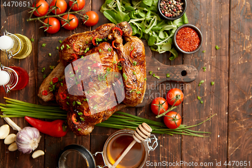 Image of Roasted whole chicken or turkey served with chilli pepers and chive