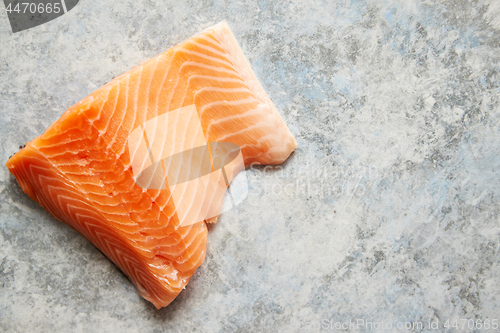 Image of Raw fresh salmon meat placed on gray stone background