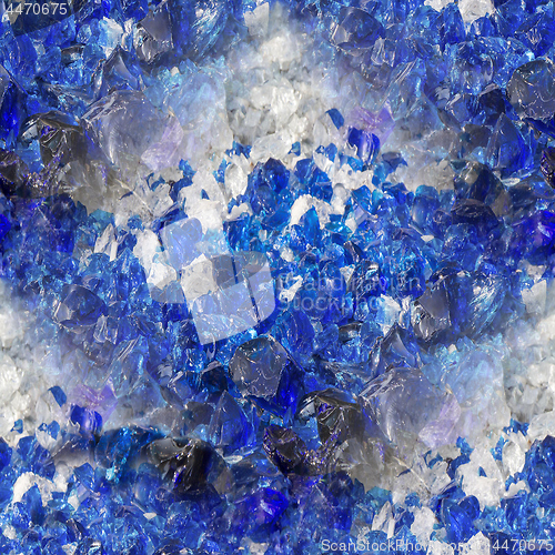 Image of Many broken pieces of glass in white and blue, as seamless backg