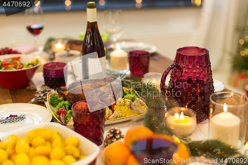 Image of food and drinks on christmas table at home