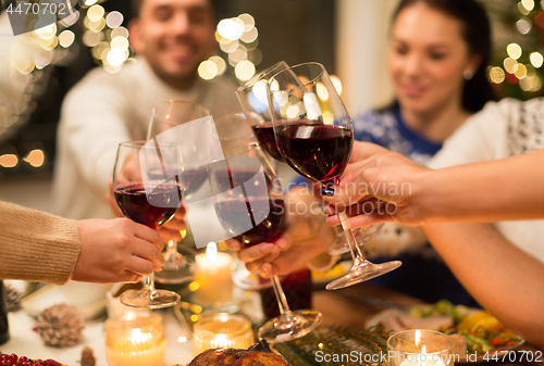 Image of close up of friends with wine celebrate christmas