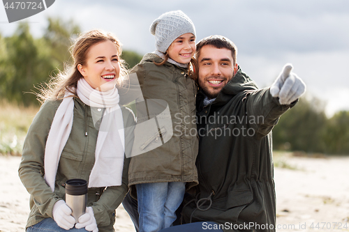 Image of happy family on autumn beach