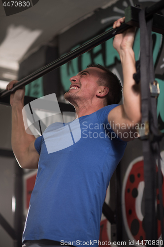 Image of man doing pull ups