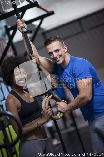 Image of Portrait of multiethnic couple  after workout at gym