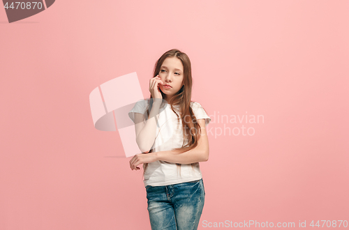 Image of Young serious thoughtful teen girl. Doubt concept.