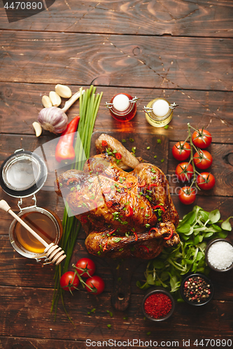 Image of Roasted whole chicken or turkey served with chilli pepers and chive