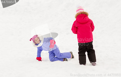 Image of happy little girls playing outdoors in winter