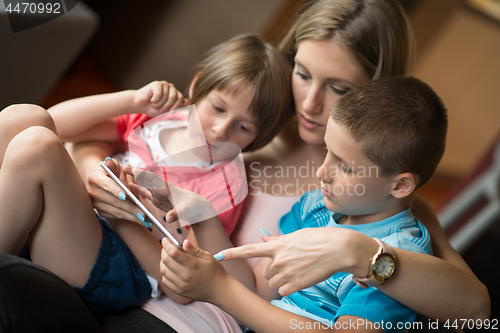 Image of Young Family Using A Tablet To Make Future Plans