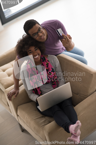 Image of african american couple shopping online