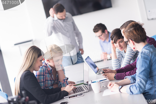 Image of Group of young people meeting in startup office