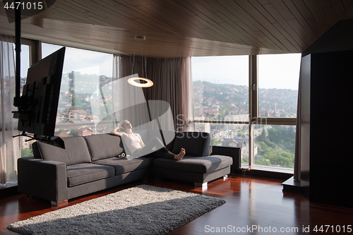 Image of woman using tablet in beautiful apartment