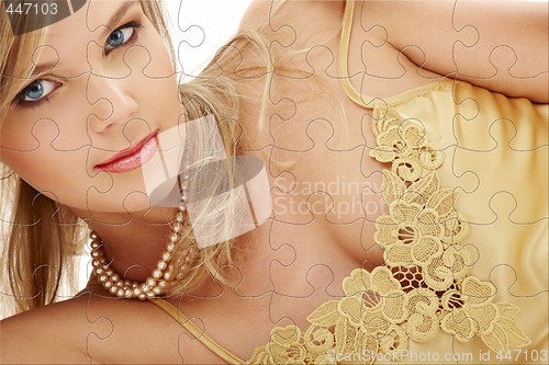 Image of mysterious blue-eyed blond in pearls puzzle