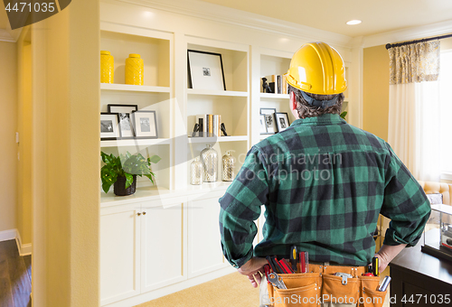 Image of Contractor Facing Custom Built-in Shelves and Cabinets Wall